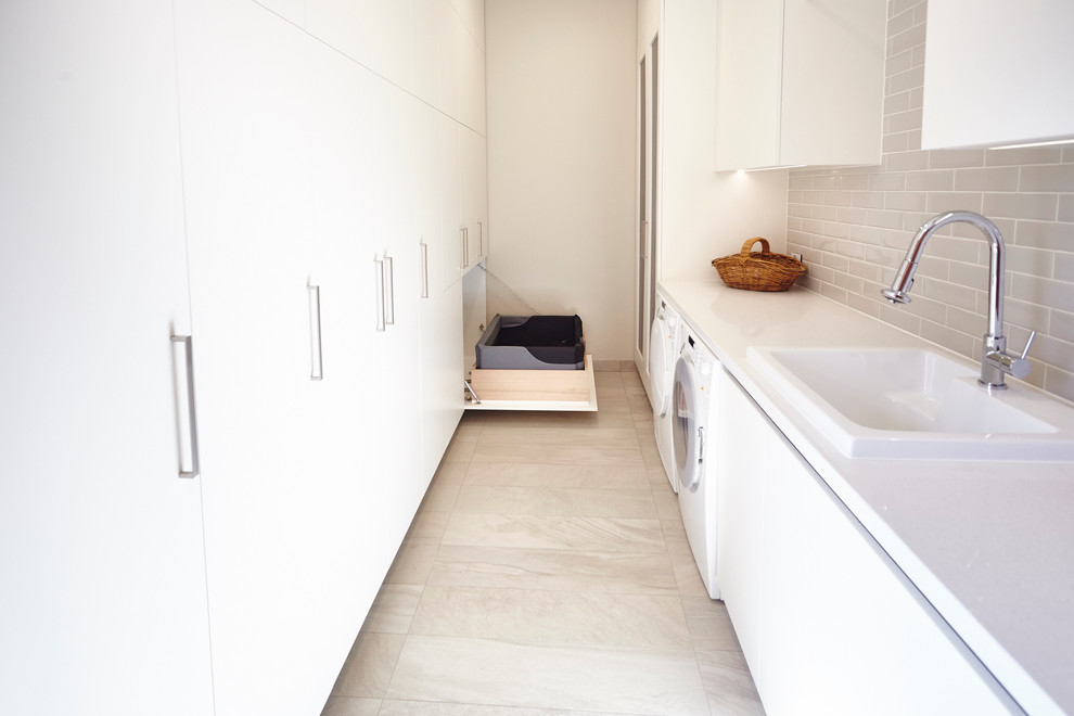 Example of a trendy laundry room design in Melbourne