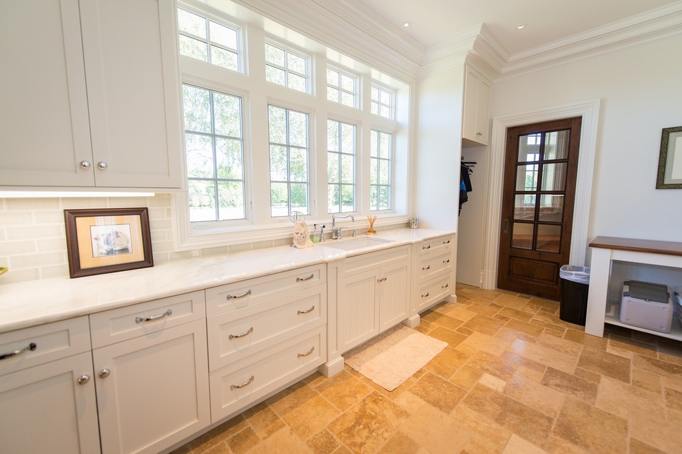 Large elegant porcelain tile utility room photo in New York with an undermount sink, shaker cabinets, white cabinets, marble countertops, white walls and a side-by-side washer/dryer