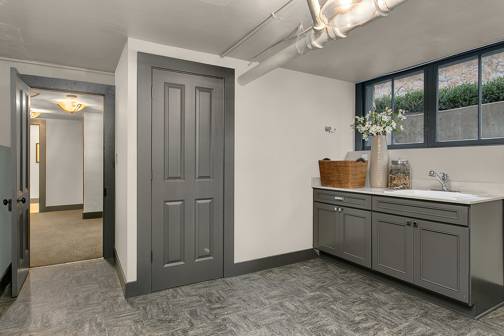 Large traditional single-wall separated utility room in Seattle with raised-panel cabinets, grey cabinets, quartz worktops, grey walls and a built-in sink.