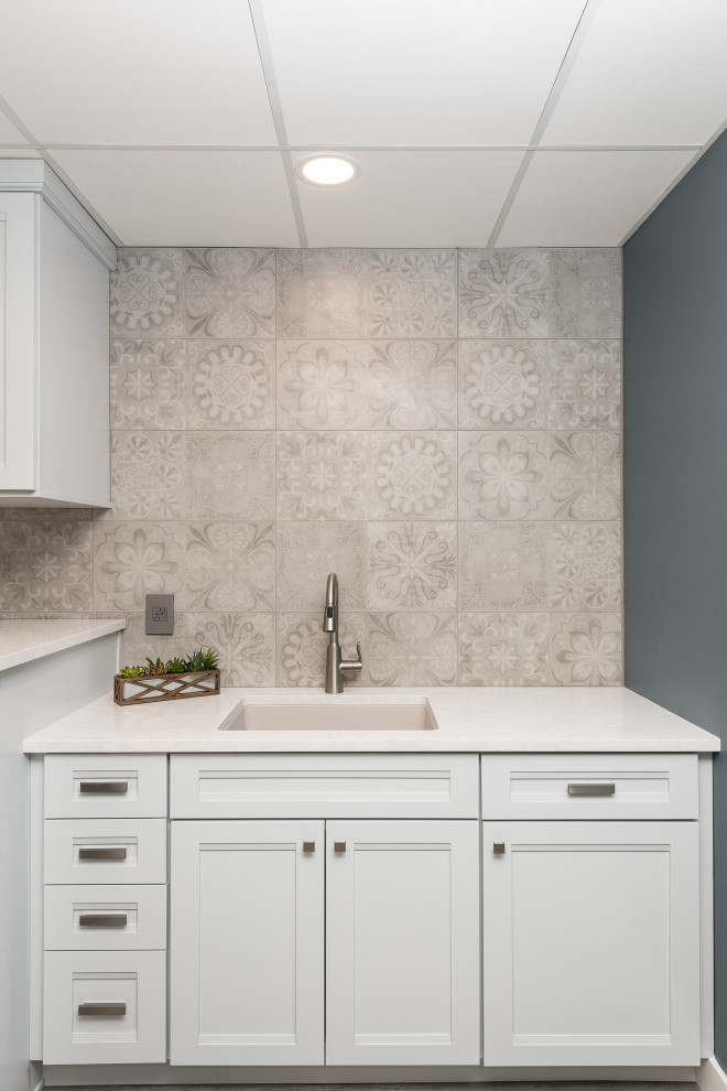 Inspiration for a mid-sized transitional galley laminate floor and beige floor dedicated laundry room remodel in Other with an undermount sink, recessed-panel cabinets, white cabinets, quartz countertops, beige walls, a side-by-side washer/dryer and white countertops