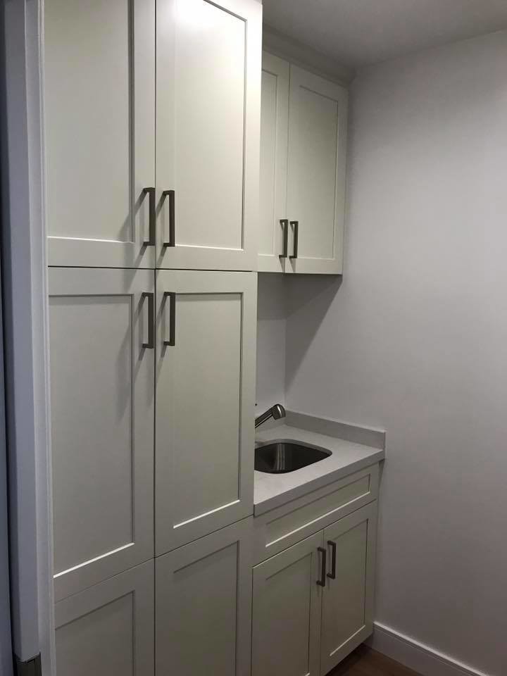 Inspiration for a small classic single-wall separated utility room in Los Angeles with a submerged sink, shaker cabinets, white cabinets, laminate countertops and white walls.