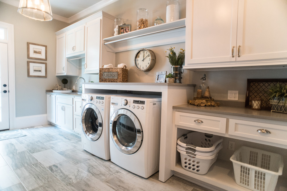 Farmhouse single-wall dedicated laundry room photo in Atlanta with an undermount sink, recessed-panel cabinets, white cabinets, a side-by-side washer/dryer and gray countertops