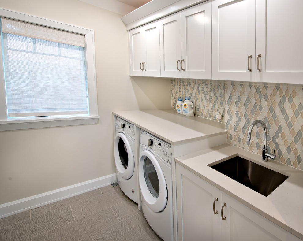Example of a mid-sized trendy gray floor utility room design in Chicago with a drop-in sink, white cabinets, concrete countertops, multicolored backsplash, ceramic backsplash and gray countertops