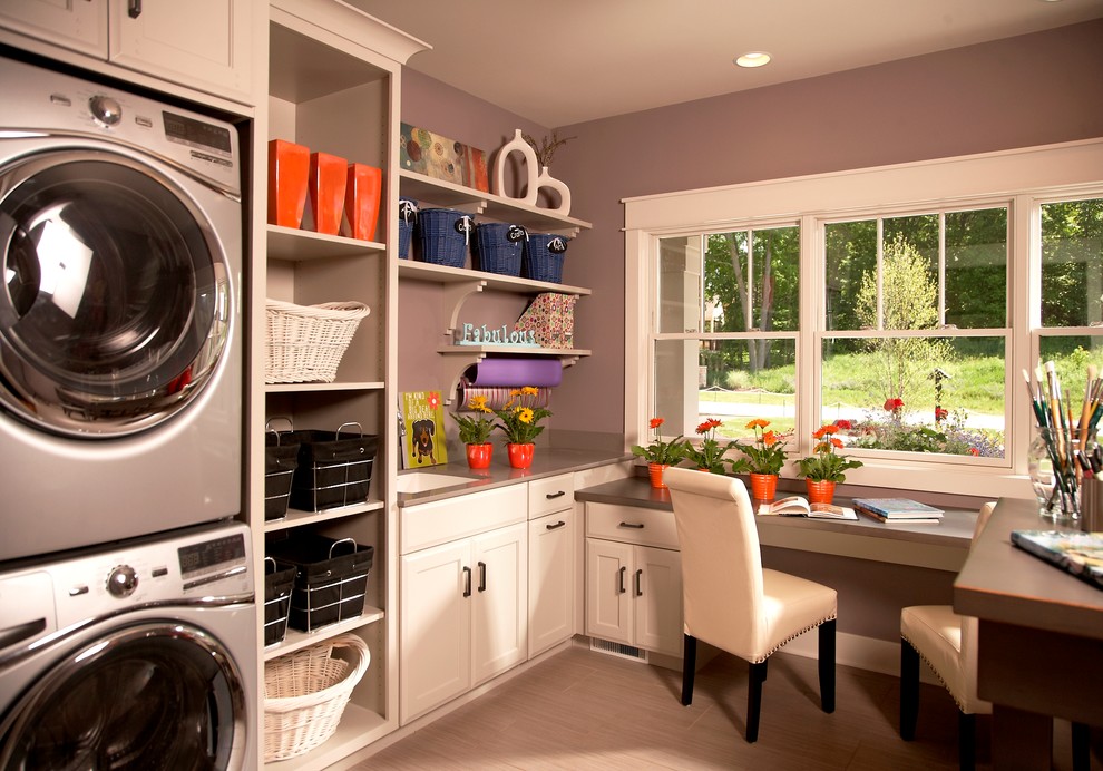 Elegant laundry room photo in Detroit with a stacked washer/dryer