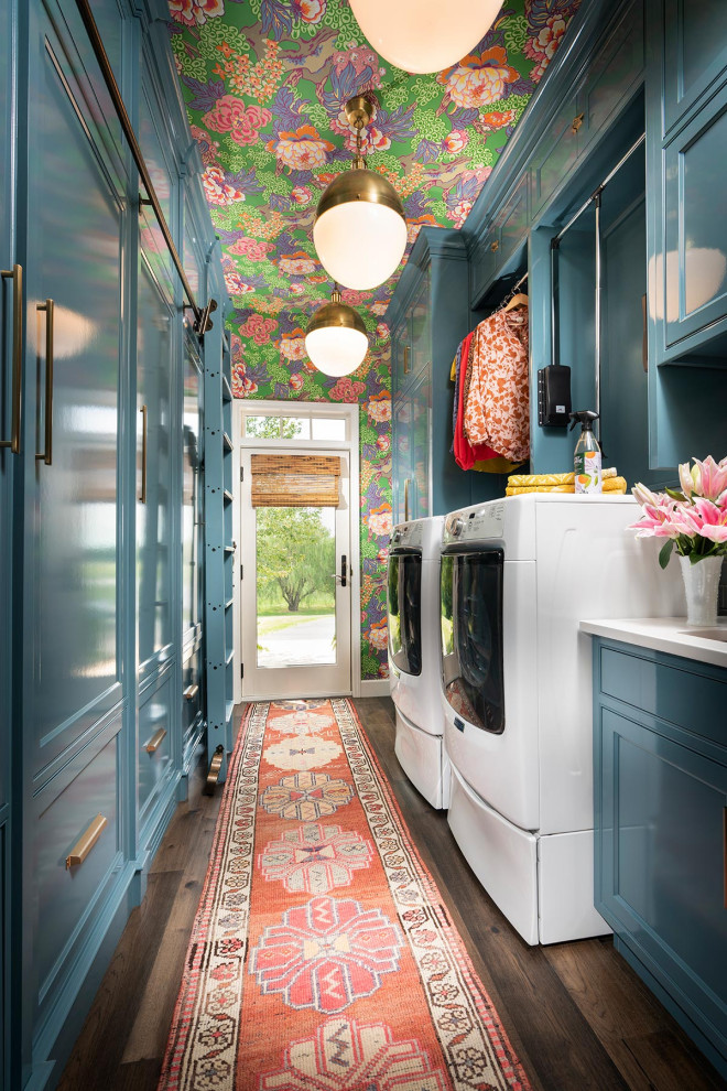 Utility room - mid-sized traditional galley dark wood floor and wallpaper ceiling utility room idea in Other with an undermount sink, blue cabinets, quartz countertops, blue backsplash, subway tile backsplash, blue walls, a side-by-side washer/dryer and white countertops