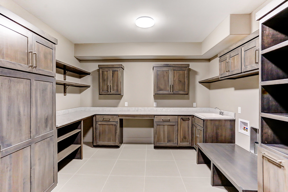 Inspiration for a mid-sized rustic l-shaped porcelain tile and beige floor utility room remodel in Other with shaker cabinets, medium tone wood cabinets, quartz countertops, beige walls and a side-by-side washer/dryer