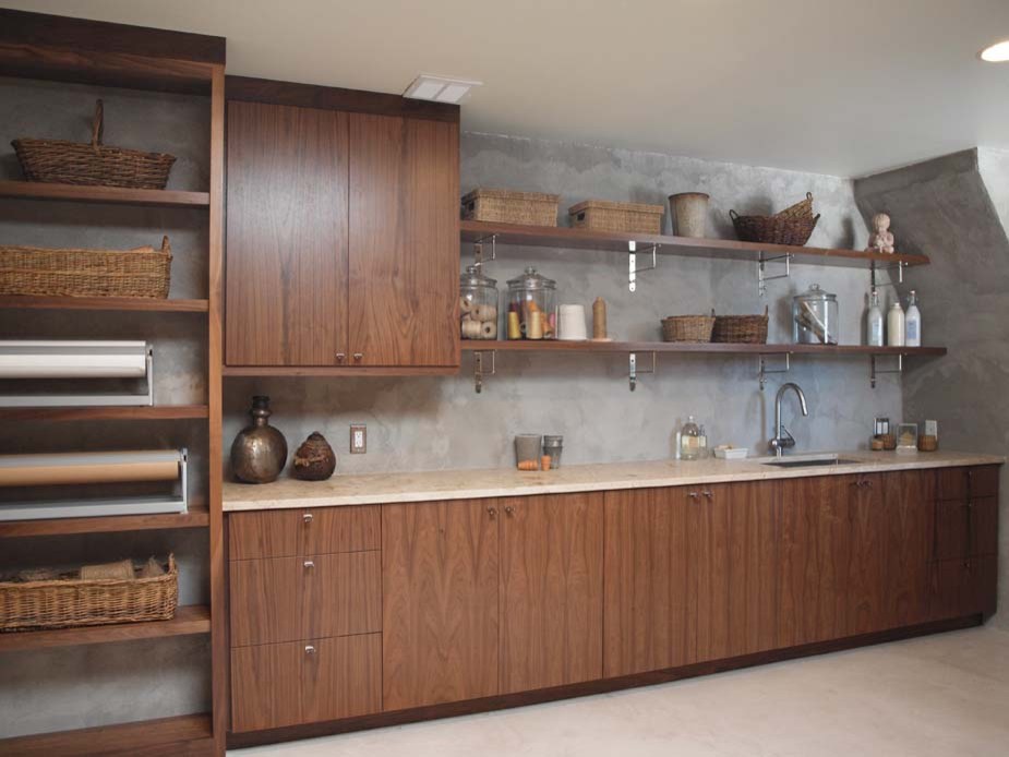 This is an example of a medium sized modern single-wall utility room in Chicago with flat-panel cabinets, limestone worktops, grey walls and dark wood cabinets.