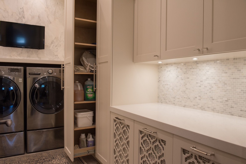 Example of a large tuscan u-shaped ceramic tile dedicated laundry room design in Vancouver with an undermount sink, shaker cabinets, white cabinets, granite countertops, a side-by-side washer/dryer and white walls