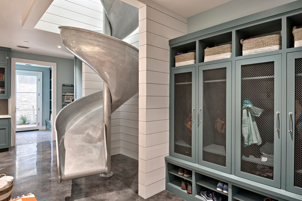 Inspiration for a huge country galley concrete floor utility room remodel in Austin with blue cabinets, quartz countertops, blue walls, a side-by-side washer/dryer and shaker cabinets