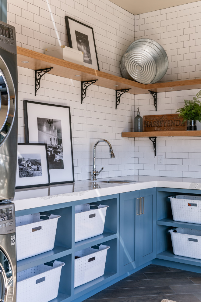 Example of a large mountain style u-shaped light wood floor laundry room design in Other with flat-panel cabinets and medium tone wood cabinets