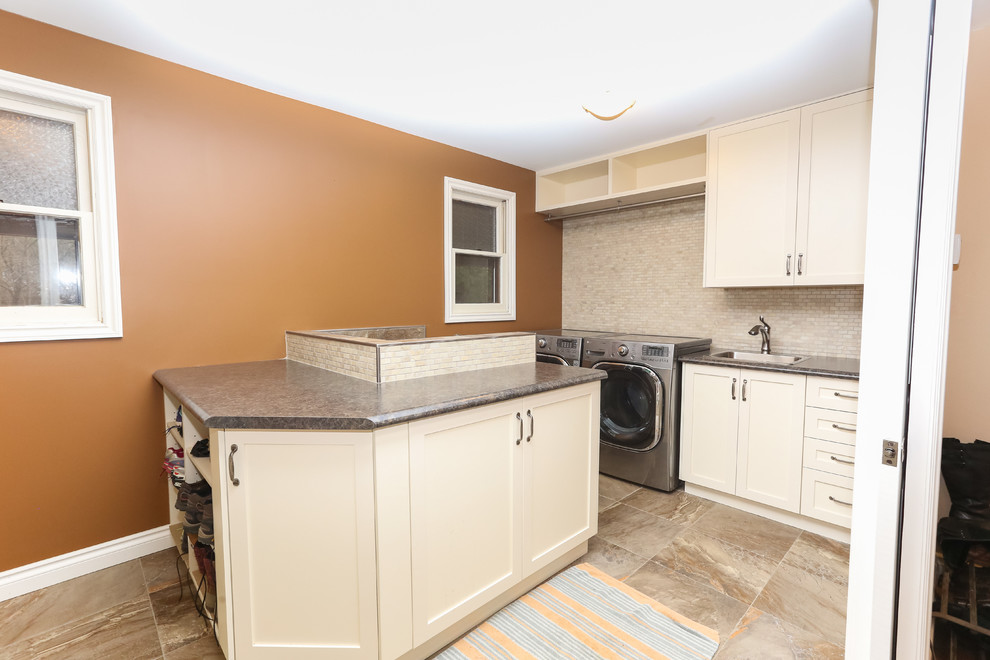 Inspiration for a medium sized classic galley utility room in Toronto with a built-in sink, shaker cabinets, white cabinets, laminate countertops, brown walls, porcelain flooring, a side by side washer and dryer and grey floors.