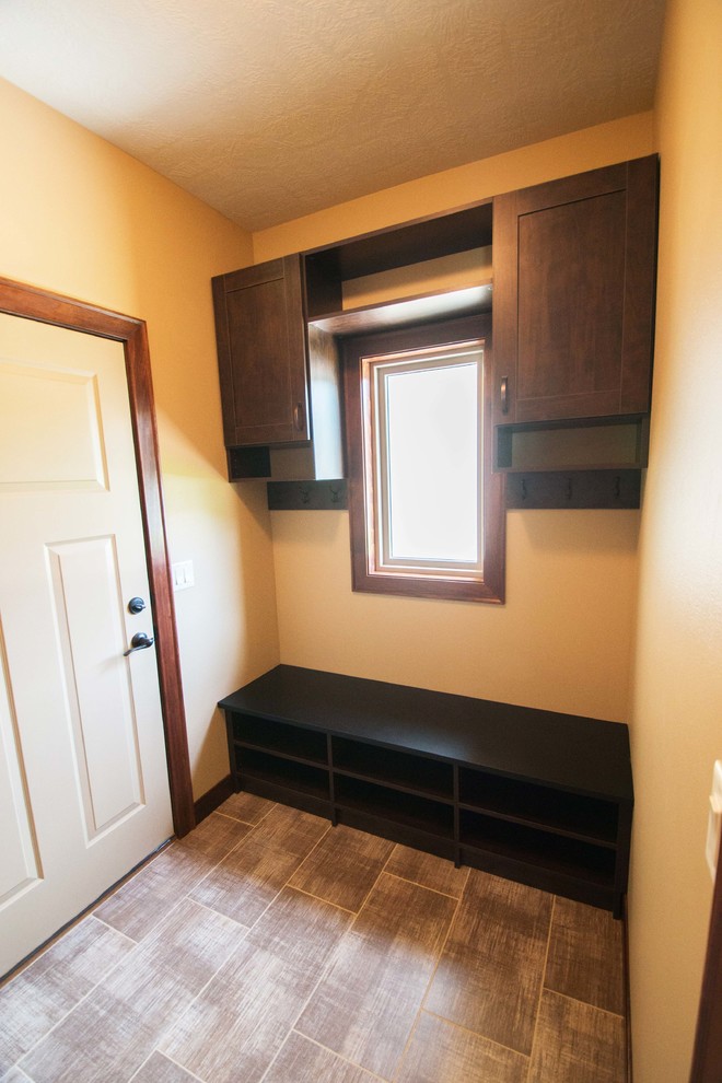 This is an example of a classic utility room in Other with beige walls.