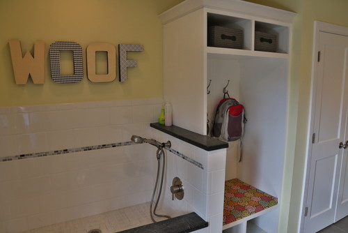 Dog shower in mud room with WOOf sign