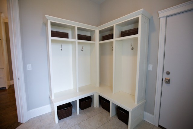 Example of a large farmhouse u-shaped travertine floor laundry room design in Chicago with gray walls, flat-panel cabinets, white cabinets and quartz countertops