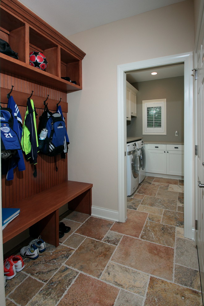 Small traditional l-shaped utility room in Milwaukee with a submerged sink, recessed-panel cabinets, white cabinets, granite worktops, beige walls, ceramic flooring and a side by side washer and dryer.