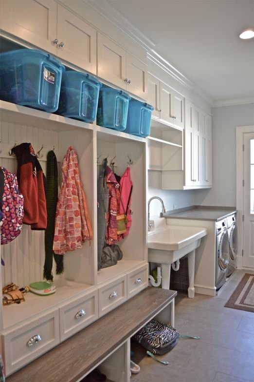 Utility room - mid-sized traditional single-wall utility room idea in Chicago with an utility sink, shaker cabinets, white cabinets, gray walls and a side-by-side washer/dryer