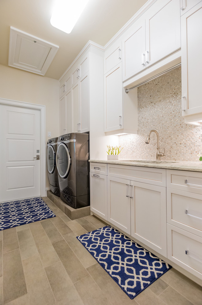 Transitional laundry room photo in Miami