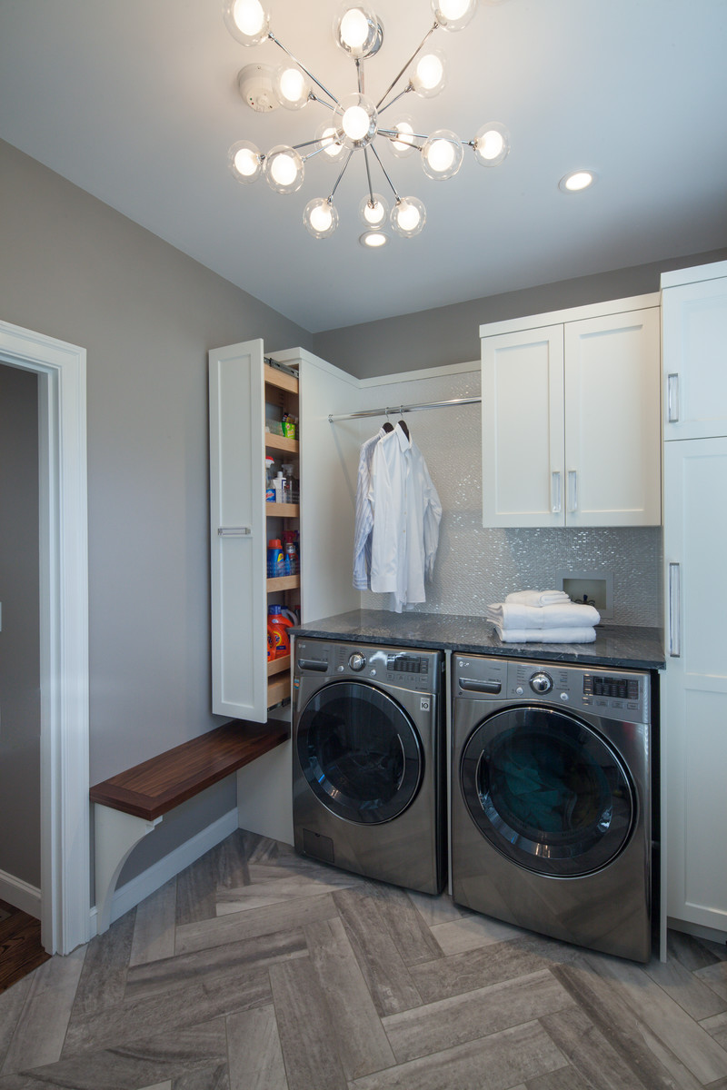 Minimalist laundry room photo in Boston