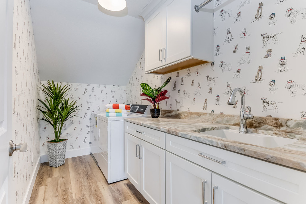 Photo of a medium sized traditional single-wall separated utility room in Other with a single-bowl sink, shaker cabinets, white cabinets, multi-coloured walls, a side by side washer and dryer, beige floors, brown worktops and wallpapered walls.