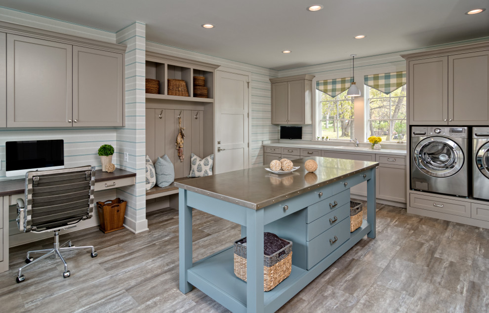Inspiration for a large coastal laminate floor, brown floor and wallpaper utility room remodel in Minneapolis with quartz countertops, a side-by-side washer/dryer, a single-bowl sink, shaker cabinets, brown cabinets, multicolored walls and white countertops