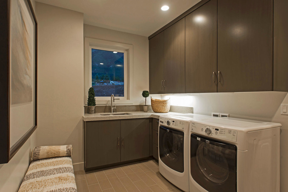 Mid-sized mountain style l-shaped ceramic tile dedicated laundry room photo in Salt Lake City with an undermount sink, flat-panel cabinets, dark wood cabinets, quartz countertops, white walls and a side-by-side washer/dryer