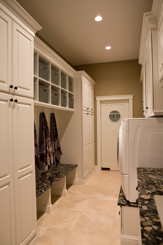 Inspiration for a craftsman galley porcelain tile utility room remodel in Other with white cabinets, granite countertops and a side-by-side washer/dryer