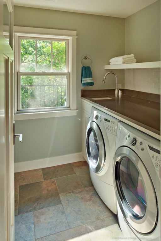 Laundry room - small craftsman single-wall porcelain tile and multicolored floor laundry room idea in Austin with an undermount sink, shaker cabinets, beige cabinets, quartz countertops, gray walls and a side-by-side washer/dryer