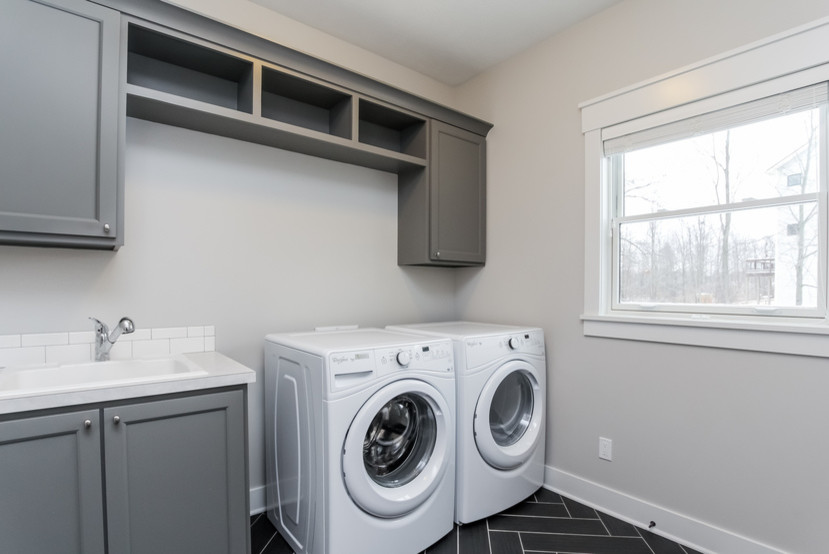 Design ideas for a large traditional utility room in Grand Rapids.