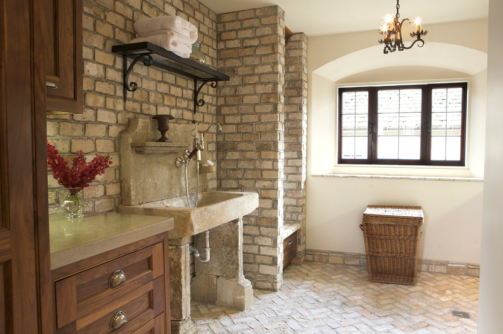 Example of a tuscan laundry room design in Orange County
