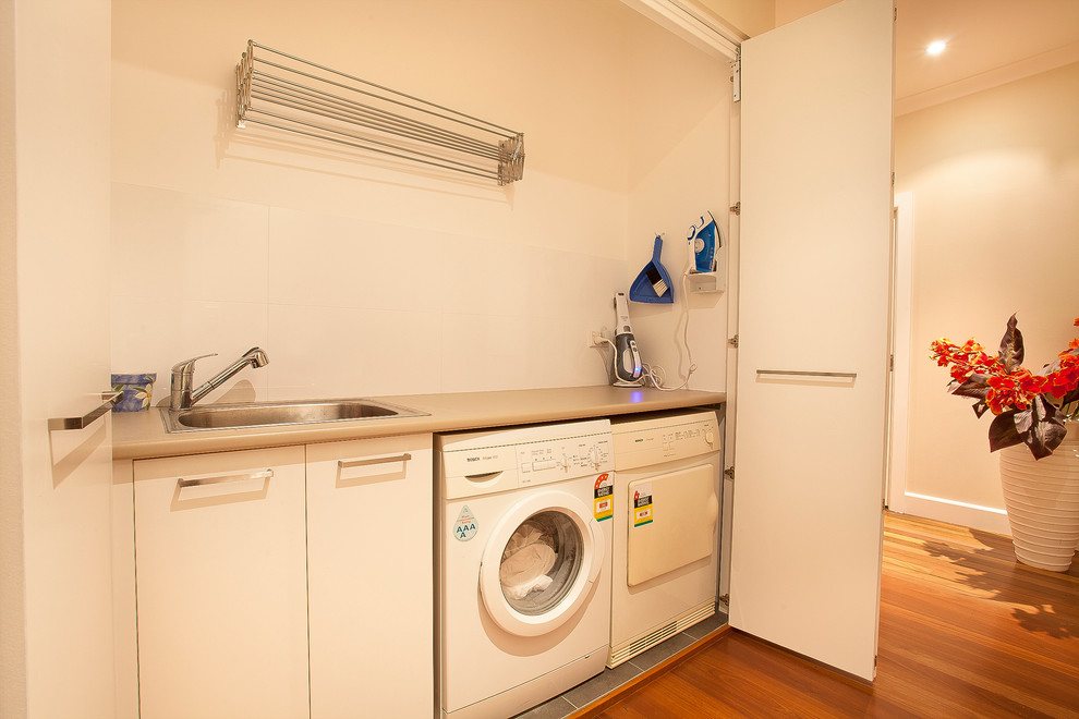 Laundry room - transitional laundry room idea in Sydney