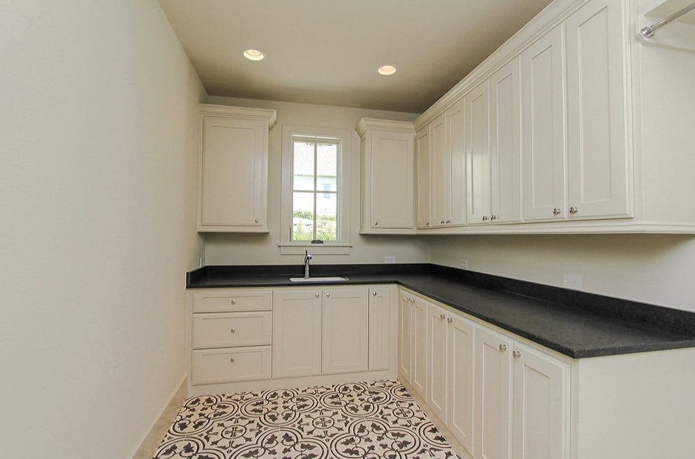 This is an example of a mediterranean utility room in Austin.
