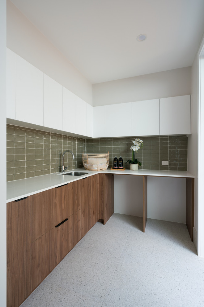 Photo of a large traditional l-shaped separated utility room in Brisbane with a submerged sink, medium wood cabinets, engineered stone countertops, white walls, ceramic flooring, a side by side washer and dryer, white floors and white worktops.