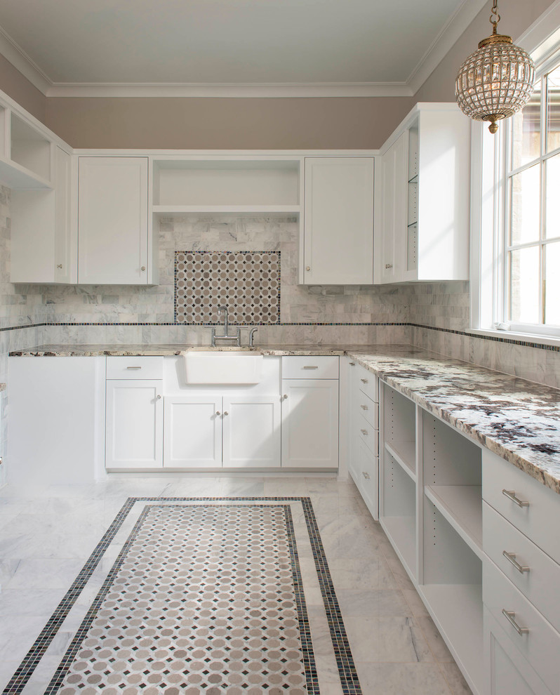 Design ideas for a medium sized classic u-shaped utility room in Dallas with a belfast sink, shaker cabinets, white cabinets, granite worktops, white splashback, stone tiled splashback, marble flooring, multi-coloured floors and grey walls.