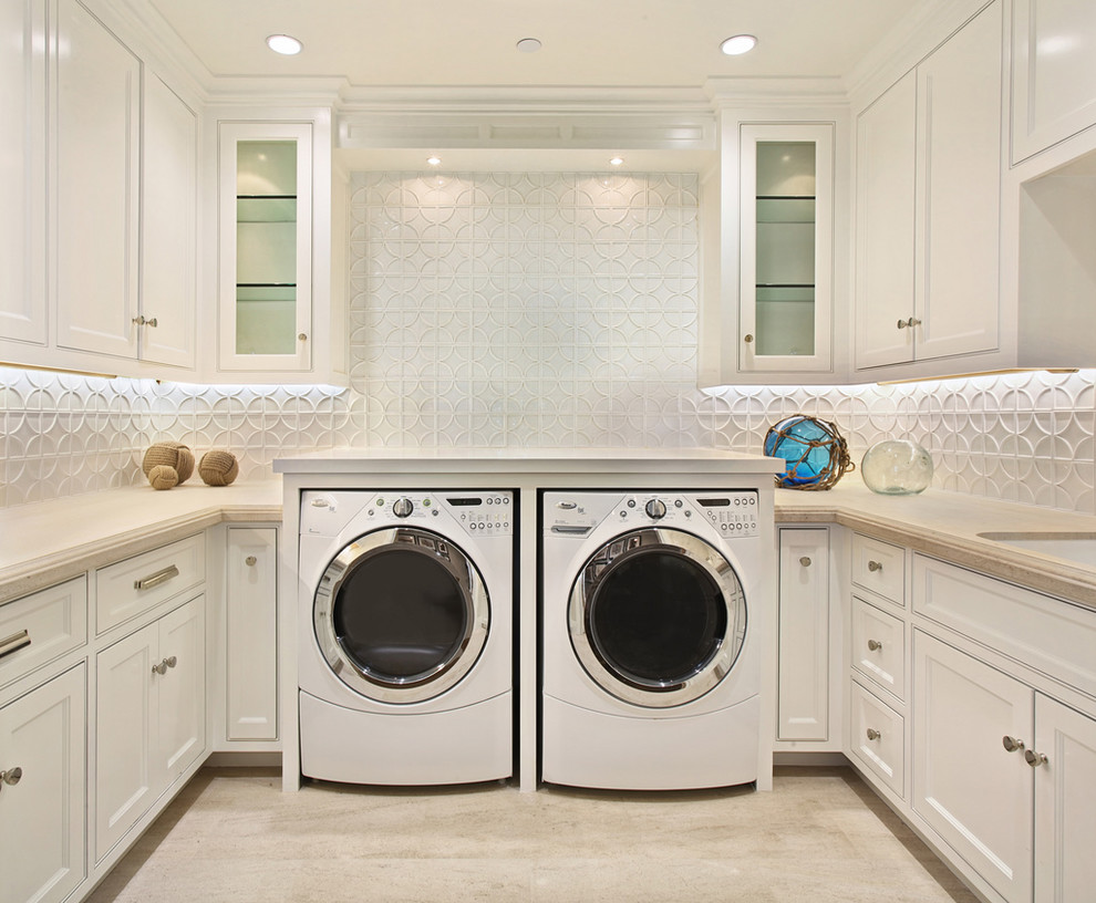 Photo of a classic utility room in Orange County with white cabinets, beige floors and beige worktops.