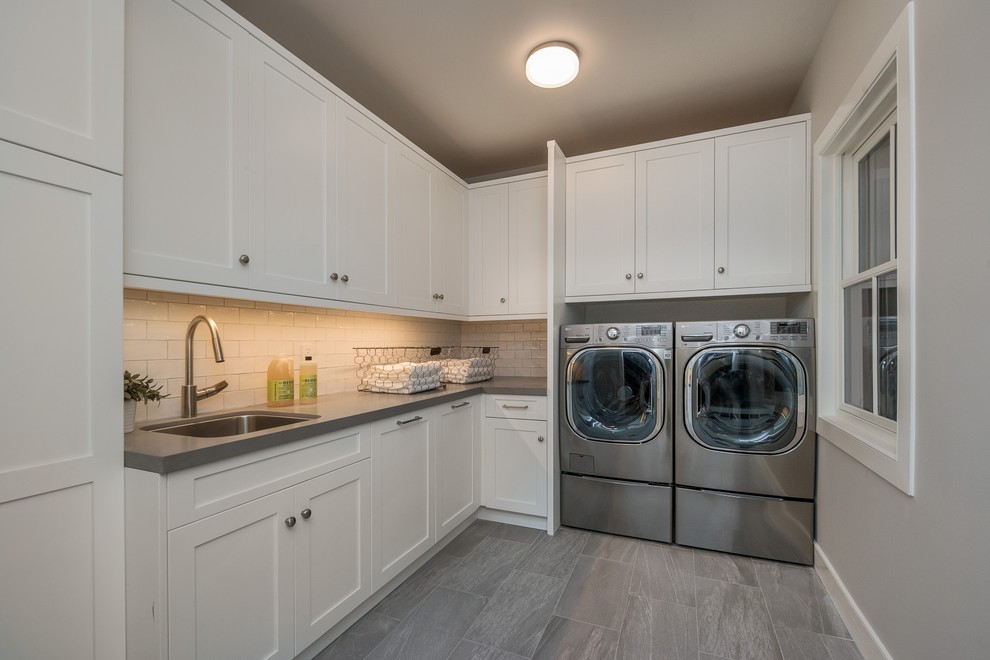 Design ideas for a medium sized farmhouse l-shaped separated utility room in San Francisco with a submerged sink, shaker cabinets, white cabinets, engineered stone countertops, grey walls, porcelain flooring, a side by side washer and dryer and grey floors.