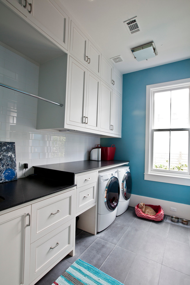 Example of a transitional laundry room design in Houston