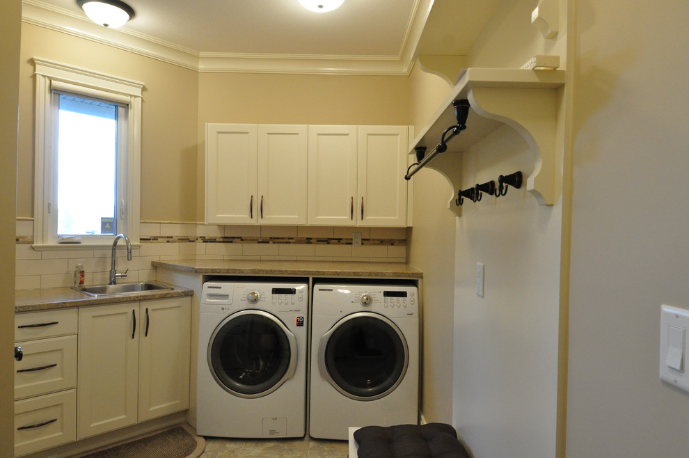 Arts and crafts porcelain tile laundry room photo in Vancouver with a side-by-side washer/dryer