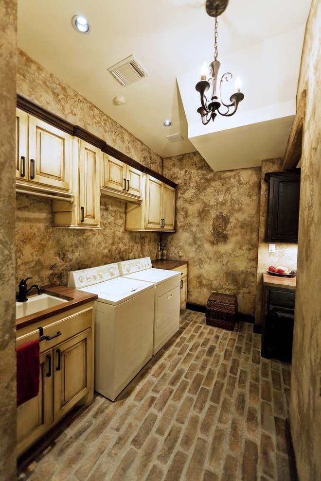 This is an example of a mediterranean utility room in Houston.