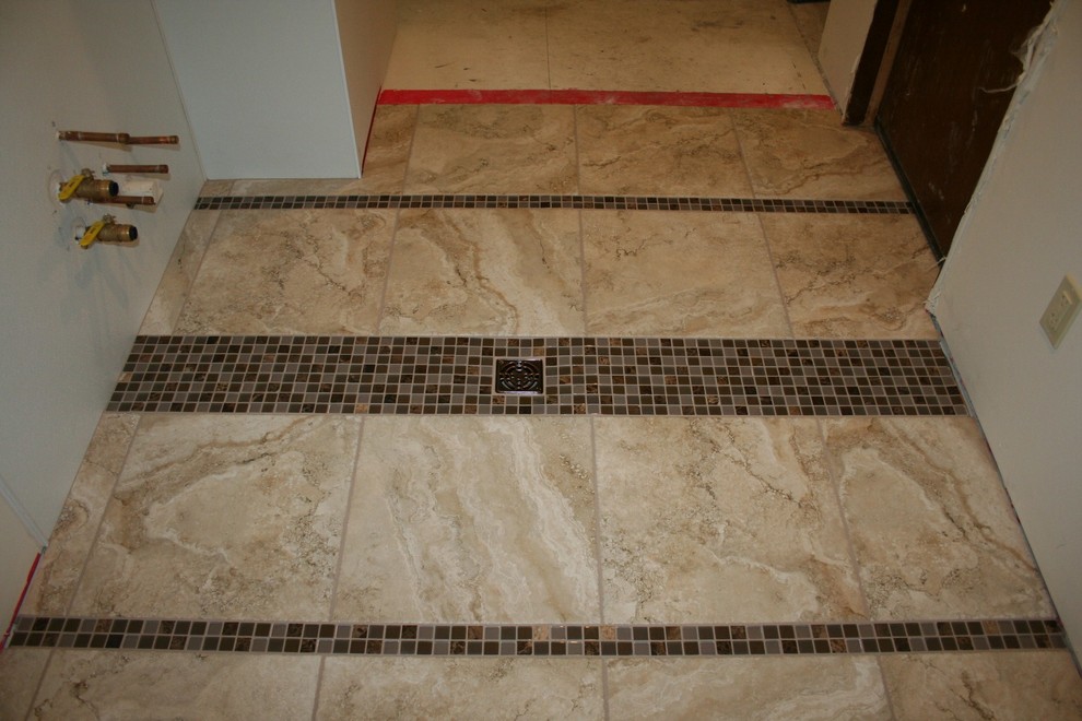 Mid-sized minimalist u-shaped porcelain tile utility room photo in Milwaukee with an utility sink and a side-by-side washer/dryer