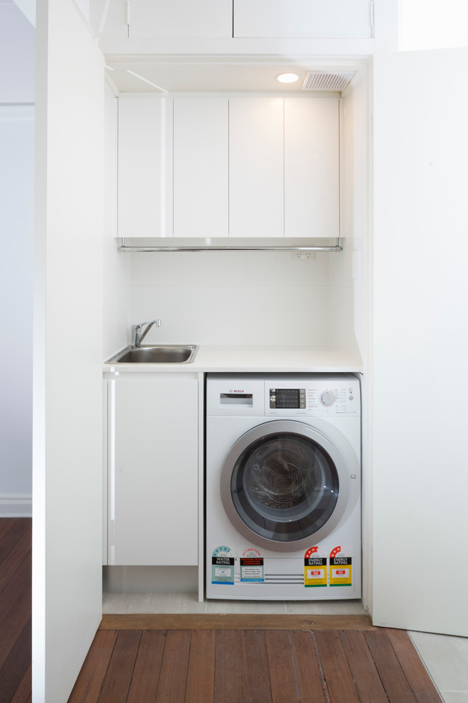 Trendy laundry room photo in Sydney