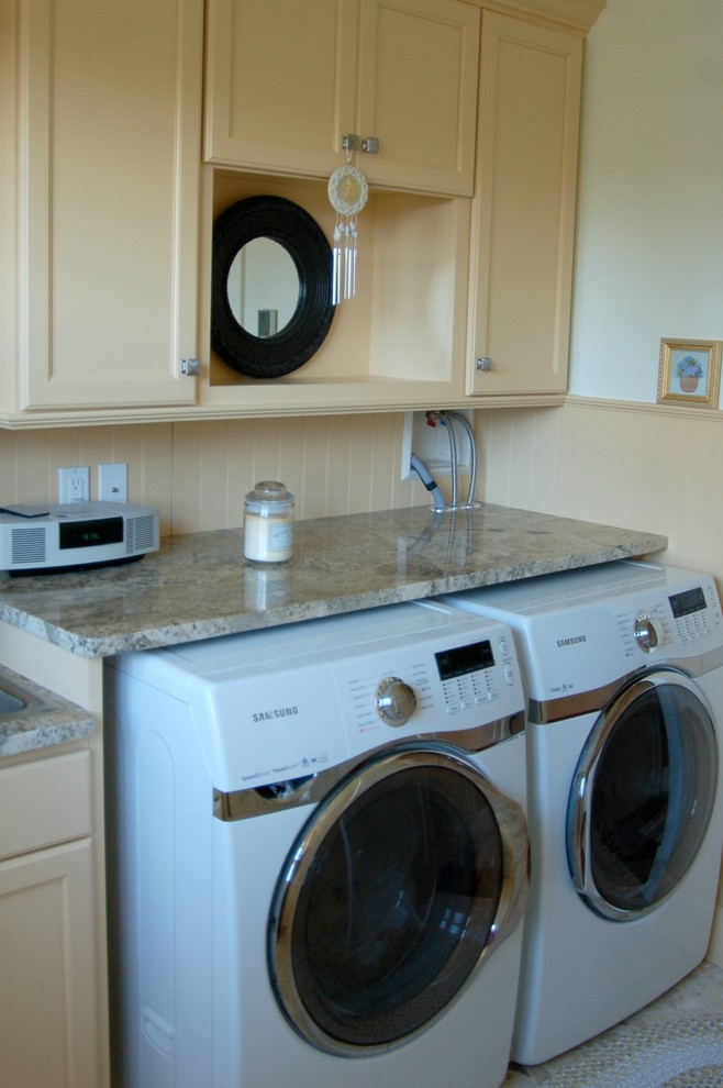 Example of a mid-sized beach style yellow floor utility room design in Boston with a drop-in sink, recessed-panel cabinets, yellow cabinets, granite countertops, white walls and a side-by-side washer/dryer