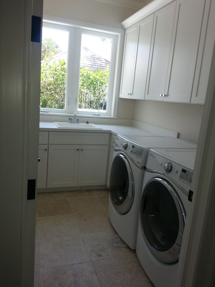 Example of a beach style laundry room design in Miami