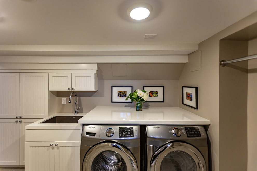 Example of a large classic single-wall vinyl floor and beige floor dedicated laundry room design in Minneapolis with an undermount sink, beaded inset cabinets, white cabinets, marble countertops, beige walls, a side-by-side washer/dryer and white countertops