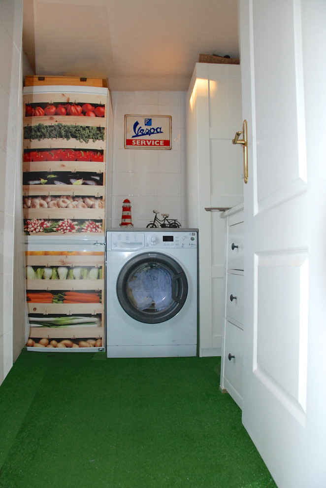 Example of a small 1960s l-shaped utility room design in Madrid with flat-panel cabinets, white cabinets and white walls