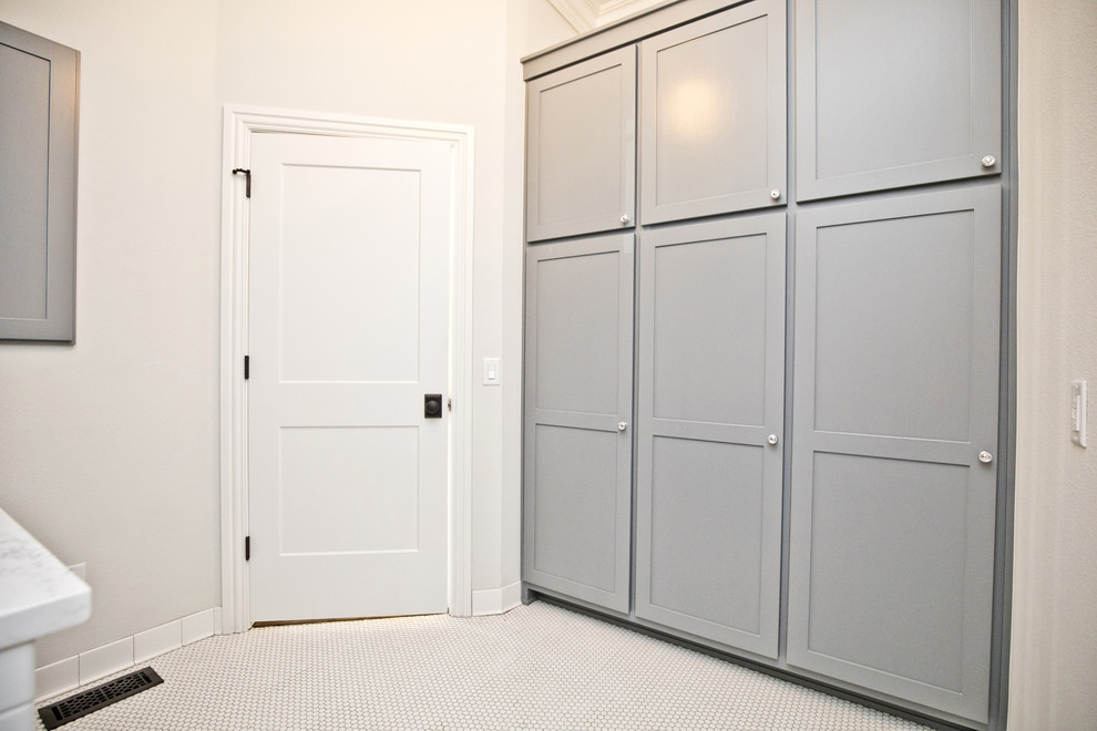 Medium sized classic single-wall separated utility room in Other with shaker cabinets, grey cabinets, grey walls, a stacked washer and dryer and white worktops.