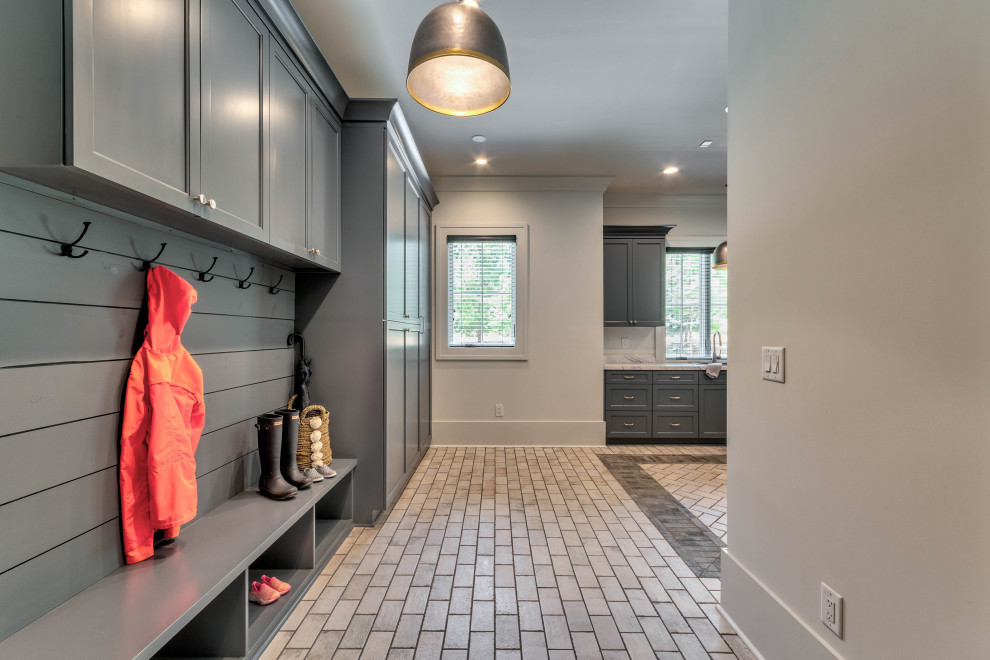 Large traditional u-shaped utility room in Atlanta with a built-in sink, shaker cabinets, white cabinets, laminate countertops, white walls, ceramic flooring, a side by side washer and dryer, white floors, white worktops and tongue and groove walls.
