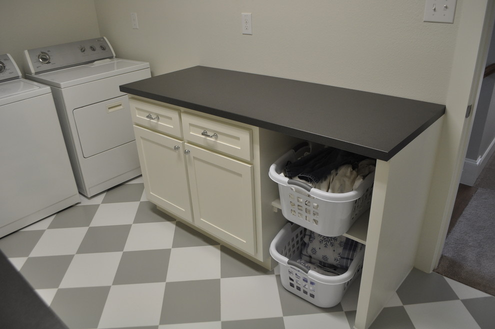 Inspiration for a timeless u-shaped vinyl floor dedicated laundry room remodel in Dallas with an undermount sink, shaker cabinets, white cabinets, granite countertops, gray walls and a side-by-side washer/dryer