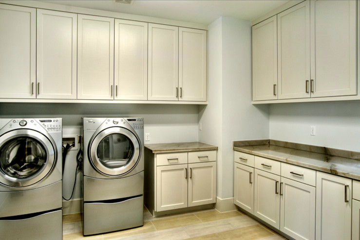 Example of a trendy laundry room design in Houston