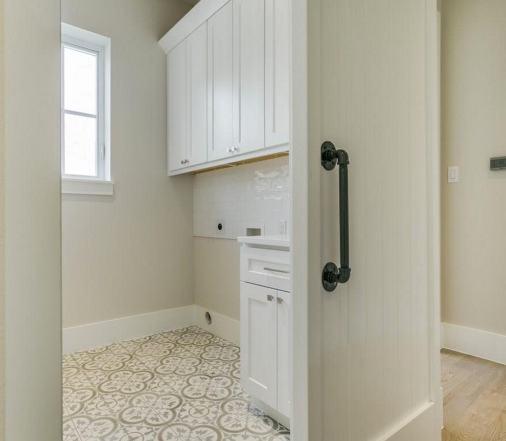 This is an example of a small rural single-wall separated utility room in Dallas with shaker cabinets, white cabinets, engineered stone countertops, white walls, ceramic flooring, a side by side washer and dryer and white worktops.