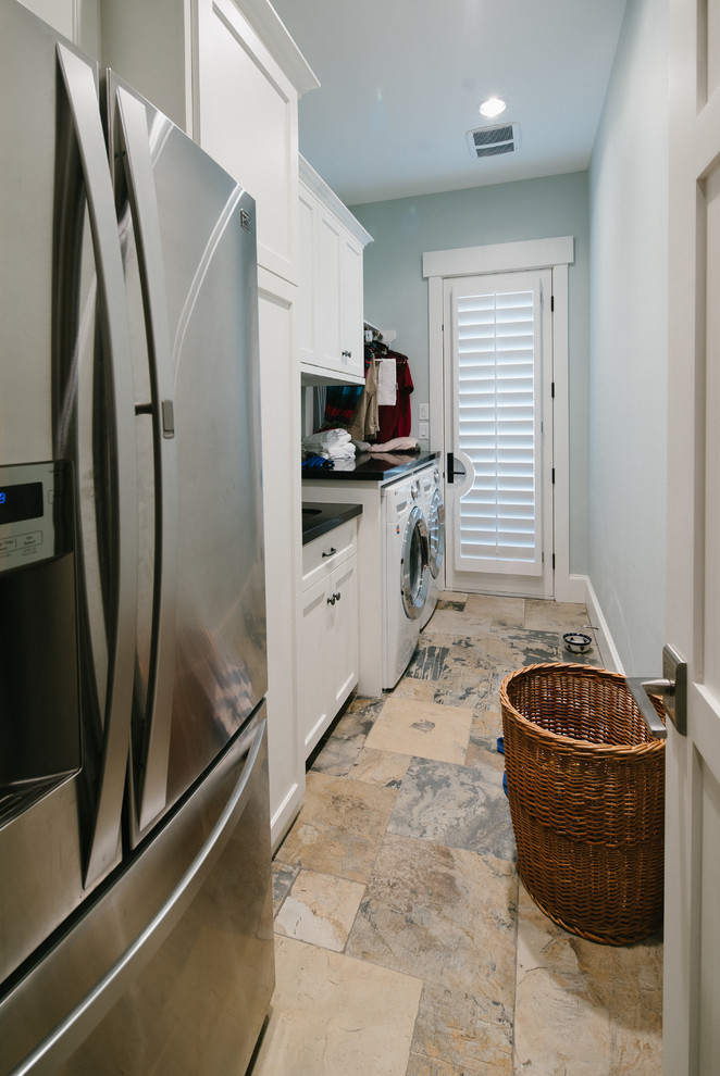 Inspiration for a mid-sized transitional galley slate floor utility room remodel in Houston with an undermount sink, shaker cabinets, white cabinets, granite countertops, blue walls and a side-by-side washer/dryer